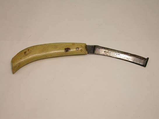 a%20hoof%20knife%20with%20curved%20blade%20and%20handle